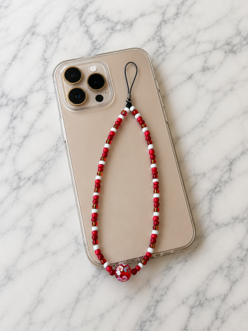 Cordon téléphone perles rouge blanc sur smartphone