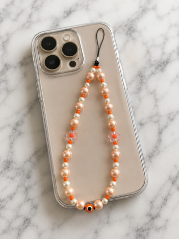 Cordon téléphone perles nacrées orange sur smartphone