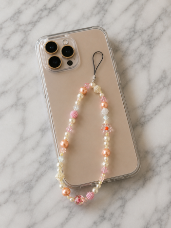 Cordon téléphone perles pastel pêche rose sur smartphone