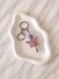 Porte-clés Fée Papillon Lilas sur fond marbré