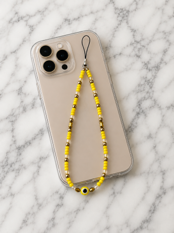 Cordon téléphone perles jaune doré sur smartphone