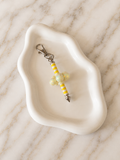Porte-clés Croix Jaune sur fond marbré