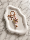 Porte-clés grande fleur dorée cristallisée avec perles roses et blanches