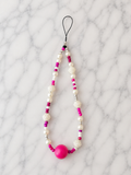 Cordon téléphone perles nacrées blanches et grande perle rose fuchsia
