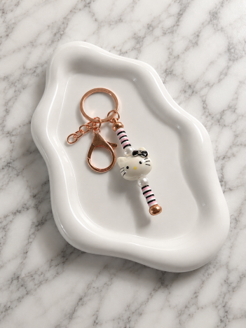 Porte-clés Hello Kitty blanc avec perles rayées et anneau doré