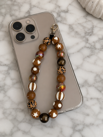 Cordon téléphone perles marron sur smartphone
