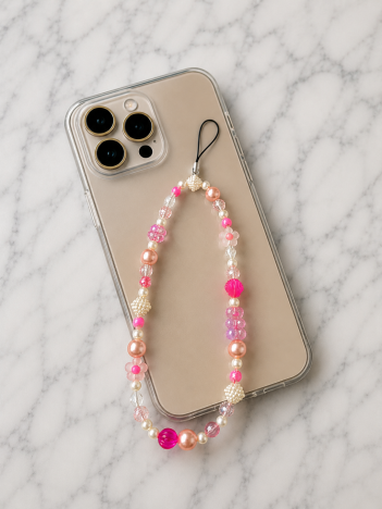 Cordon téléphone perles rose vif pêche sur smartphone
