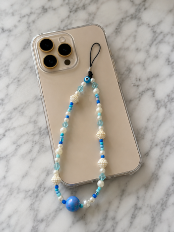 Cordon téléphone perles bleues œil porte-bonheur sur smartphone