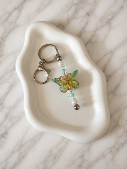 Porte-clés Fleur Dorée sur fond marbré