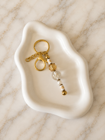 Porte-clés perles dorées et cristal translucide