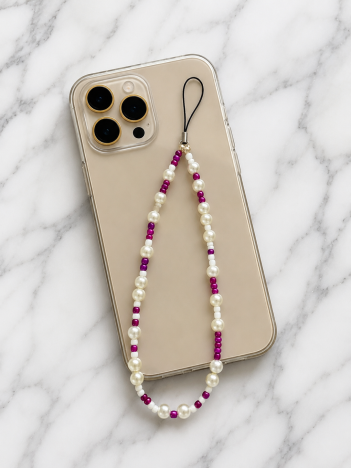 Cordon téléphone perles nacrées blanches fuchsia sur smartphone