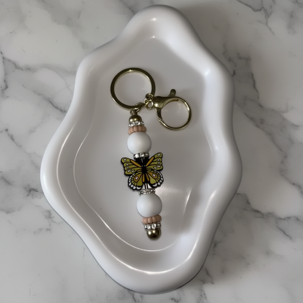 Porte-clés Papillon Jaune - fond marbré