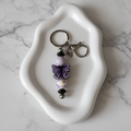 Porte-clés Papillon Violet - coupelle sur fond marbré